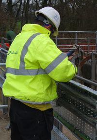 JRP technician in safety equipment undertaking on site mechanical works